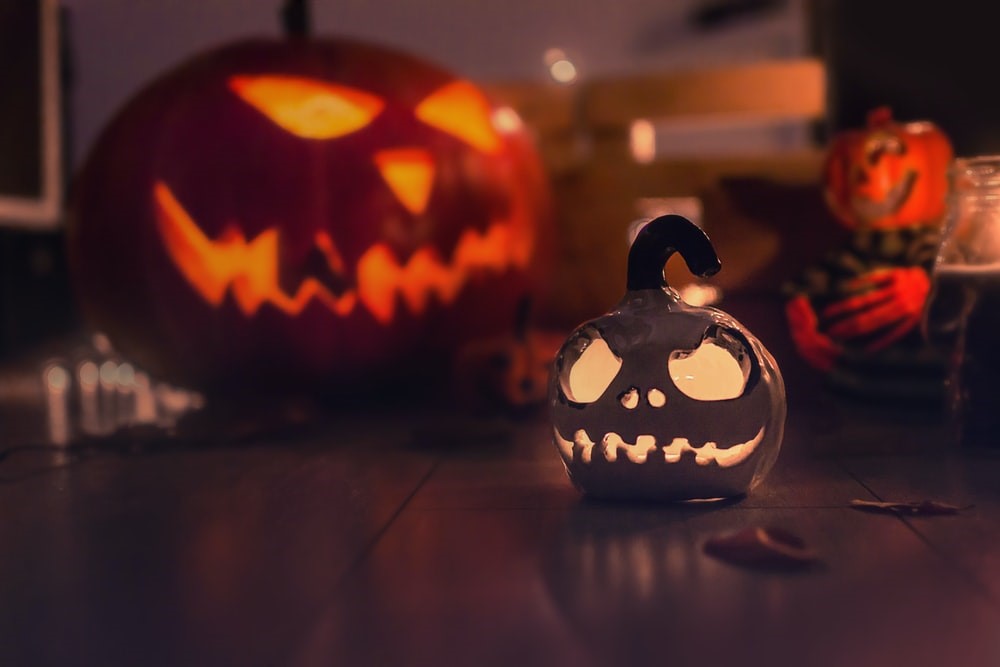 How to Clean Your Floors After Halloween? 2 Carved pumpkins placed on hardwood floor of a home